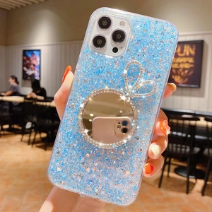 Ice blue glitter iPhone case featuring a rabbit-ear vanity mirror with sparkling rhinestones