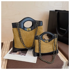 Detailed close-up of brown quilted suede bags with round cut-out handles and gold locks