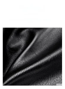 Close-up of durable black litchi pattern leather showing fine texture and grain detail