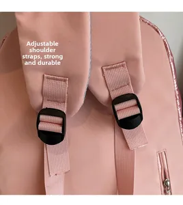 Detail of pink padded backpack showing adjustable shoulder straps and sturdy buckles