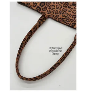 Detail shot of the reinforced leopard print tote bag straps with precise stitching work