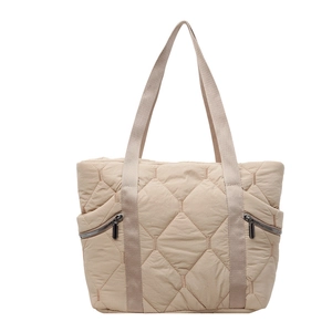 Quilted beige puffer tote bag with diamond stitching and dual side metal zippers