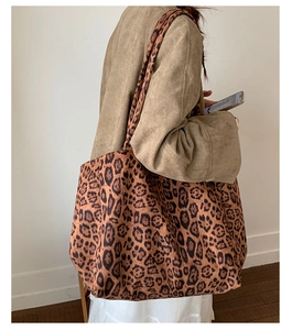 Side view of large leopard print tote bag showing spacious design and soft texture