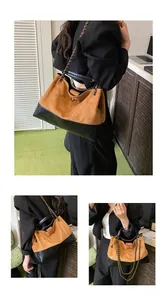 Detail of suede and quilted leather hobo bag with signature chain strap and large capacity