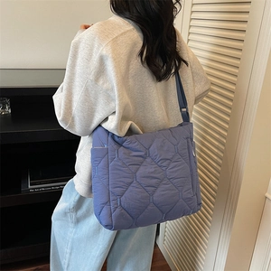 Chic quilted crossbody bag in violet blue with wide strap and grid stitching pattern