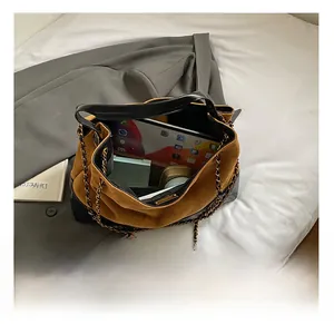 Interior view of large capacity tote bag with suede finish showing tablet and storage space