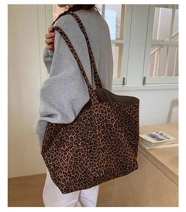 Macro view of leopard print suede tote bag showing texture and spacious casual design