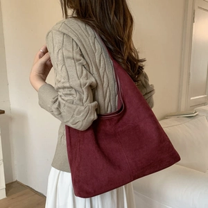 Burgundy suede shoulder tote bag for women showing a stylish large capacity design