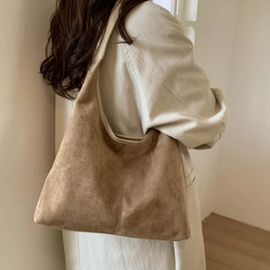 Brown suede hobo tote bag for women shown as a minimalist shoulder bag with large capacity