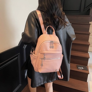 Light pink faux leather backpack for women with multi-zipper pockets and litchi texture