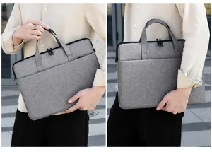 Detalle del maletín gris claro para portátil con bolsillo frontal y asa cómoda