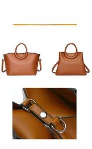 Détails du sac cabas en cuir litchi caramel montrant les fermetures éclair et anneaux