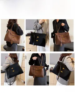Détails du grand sac cabas en cuir mat avec fermoir doré et bandoulières interchangeables