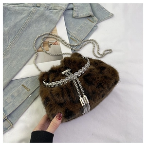 Close-up of leopard faux fur bucket bag with rhinestone trim and metal chain strap