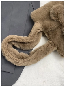 Detailed close-up of soft plush brown teddy bear shoulder bag with cute fluffy ears