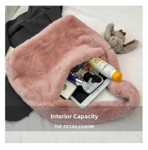 Detailed view showing pink plush tote bag capacity with tablet, phone, and cosmetics