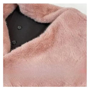 Macro detail of plush pink faux fur texture and black matte buttons on winter bag