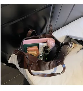Top view showing the large internal capacity of the dark brown PU leather tote bag