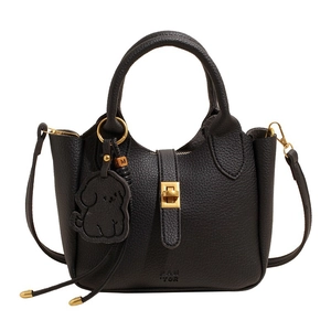 Chic black litchi pattern bucket bag with dog charm and gold hardware on white background