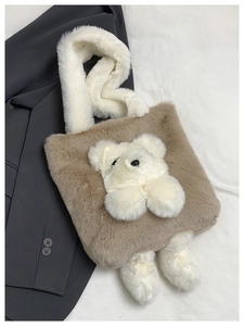 Detailed close-up of brown plush tote bag with cute 3D white bear and soft handles