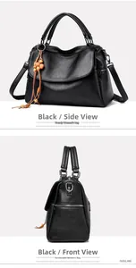Detail view of black lychee-textured leather handbag with tassel beads and crossbody strap