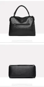 Detail view showing black litchi grain leather texture and rear zip pocket of tote bag