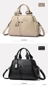Detail of apricot and black Boston bags showing lychee texture and metal studs