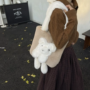 Brown plush teddy bear shoulder bag with wide white furry strap for autumn fashion style