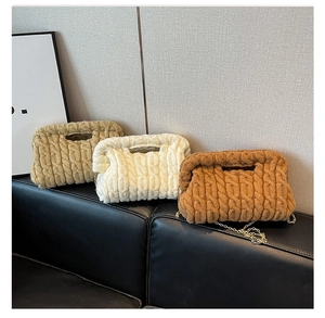 Detailed cable knit texture on crossbody bags with gold chains in khaki, cream and brown