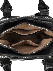 Interior view of black litchi leather Boston bag with brown lining and zip compartments