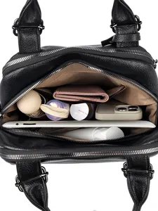 Spacious interior of black lychee leather Boston bag with organized compartments