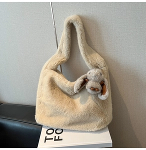Detail of plush tote bag with long-eared bunny doll and soft faux rabbit fur texture