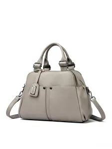 Detailed macro view of the grey lychee texture leather on this stylish Boston handbag