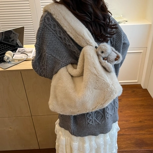 Chic beige plush shoulder bag with cute rabbit charm for women in autumn and winter