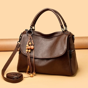Dark brown lychee pattern leather handbag with vintage wooden charm and long shoulder strap
