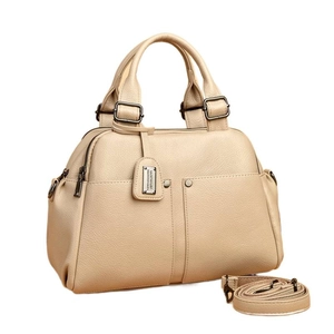 Elegant beige lychee grain Boston handbag with dual handles and adjustable shoulder strap