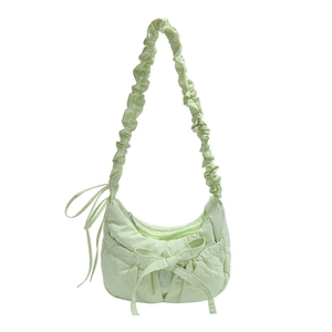 Light green ruched nylon crescent bag with stylish ribbon bow and ruffled strap