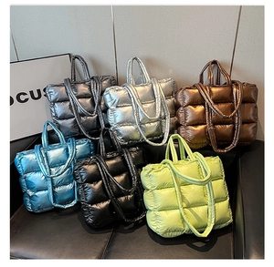 Quilted down puffer tote bags in six metallic colors with versatile shoulder straps
