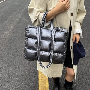 Chic metallic silver puffer tote bag with quilted padding and large capacity design