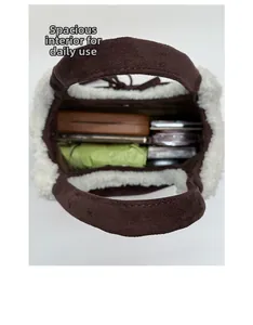 Internal view of the brown suede bucket bag showing large capacity for daily essentials