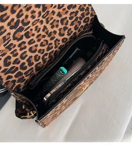 Macro shot of the interior of this leopard print crossbody bag with metal zipper pocket