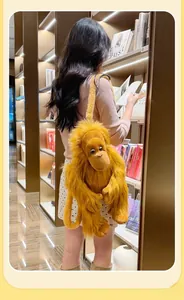 Detail of creative orange plush gorilla backpack with long fuzzy straps on a model