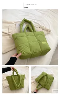 Detail of green quilted puffer tote bag with thick handles and FASHION label