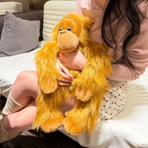 Close-up of orange long-haired gorilla plush toy with soft realistic faux fur texture