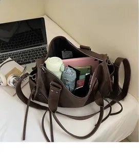 Interior detail of large brown tote bag showing spacious capacity for daily essentials