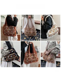 Detail view of large knit tote bag with triple-layer tassels in multiple autumn colors