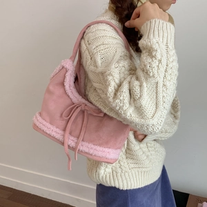 Pink faux suede shoulder tote bag with plush fleece trim and bow tie detail