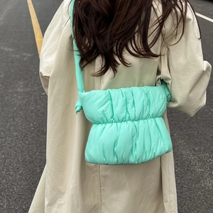 Modern mint green quilted cloud shoulder bag with stylish knotted strap detail