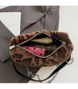 Detail view of large interior capacity in leopard print faux fur plush shoulder bag