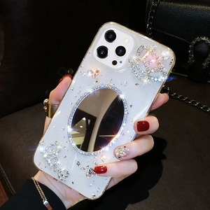 Detail of glittery iPhone case featuring an oval mirror, rhinestones and Love lettering